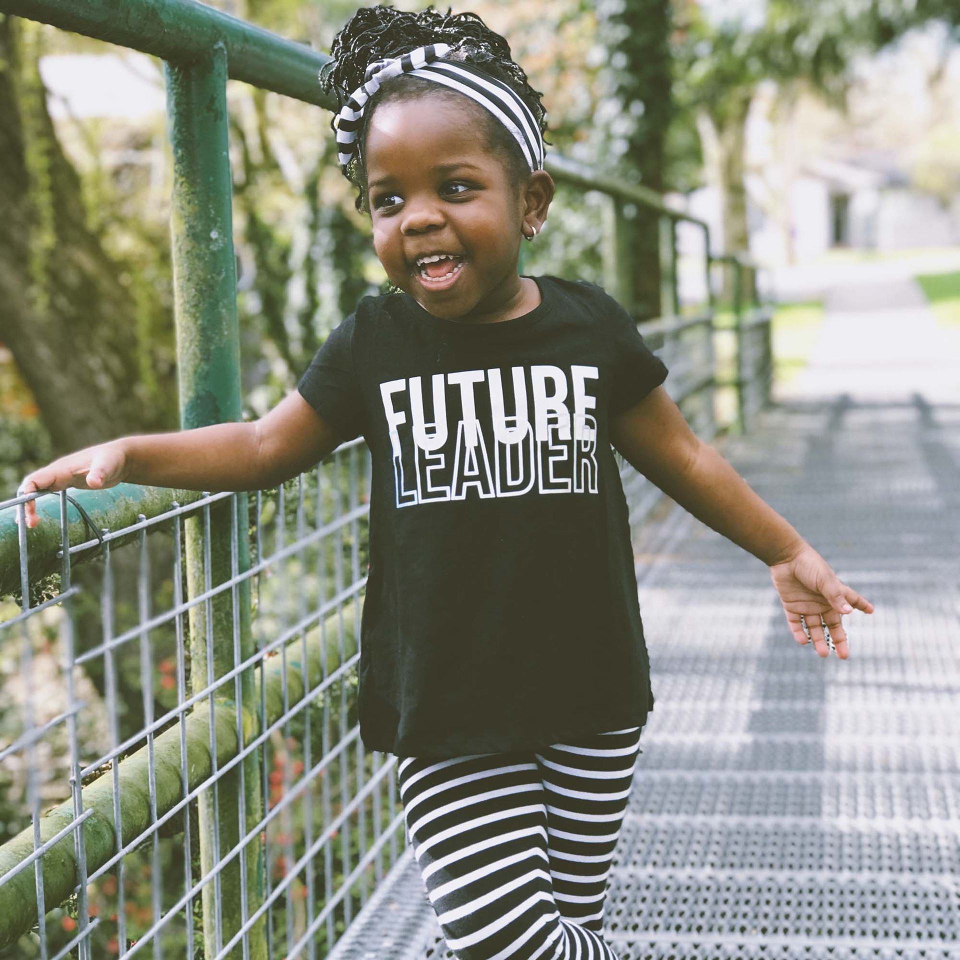 Image of a little girl wearing a shirt that says Future Leader